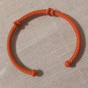 Orange cable bracelet cuff .